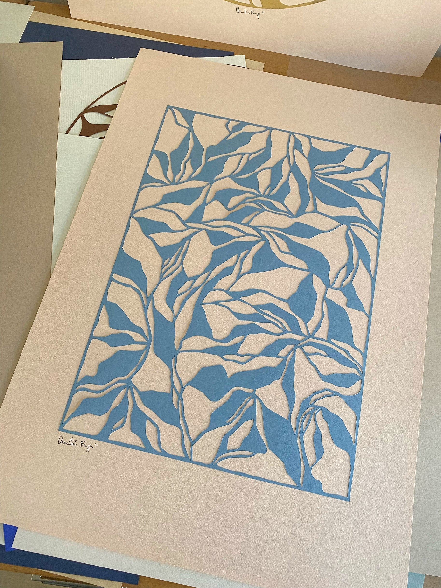 Bestilling A2 papercut grå-blå/lakse-beige